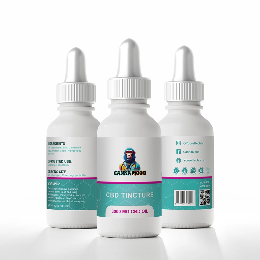 Close-up of Canna Mood CBD tincture dropper releasing a golden amber drop of CBD oil against a soft blurred background